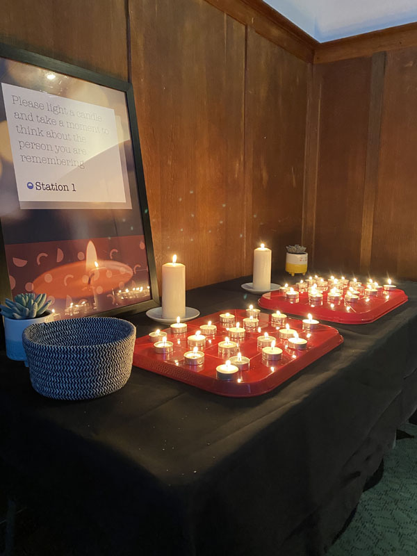 A stand with candles at the Arch remembrance event