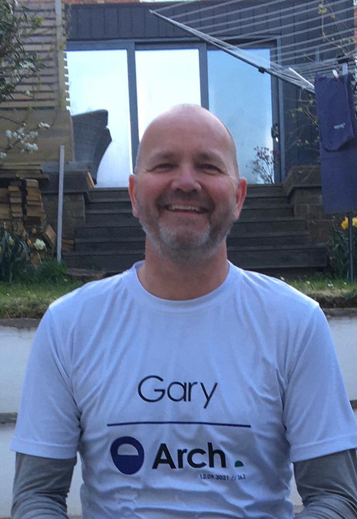 Arch CEO Gary Bishop in an arch t-shirt, smiling at the camera