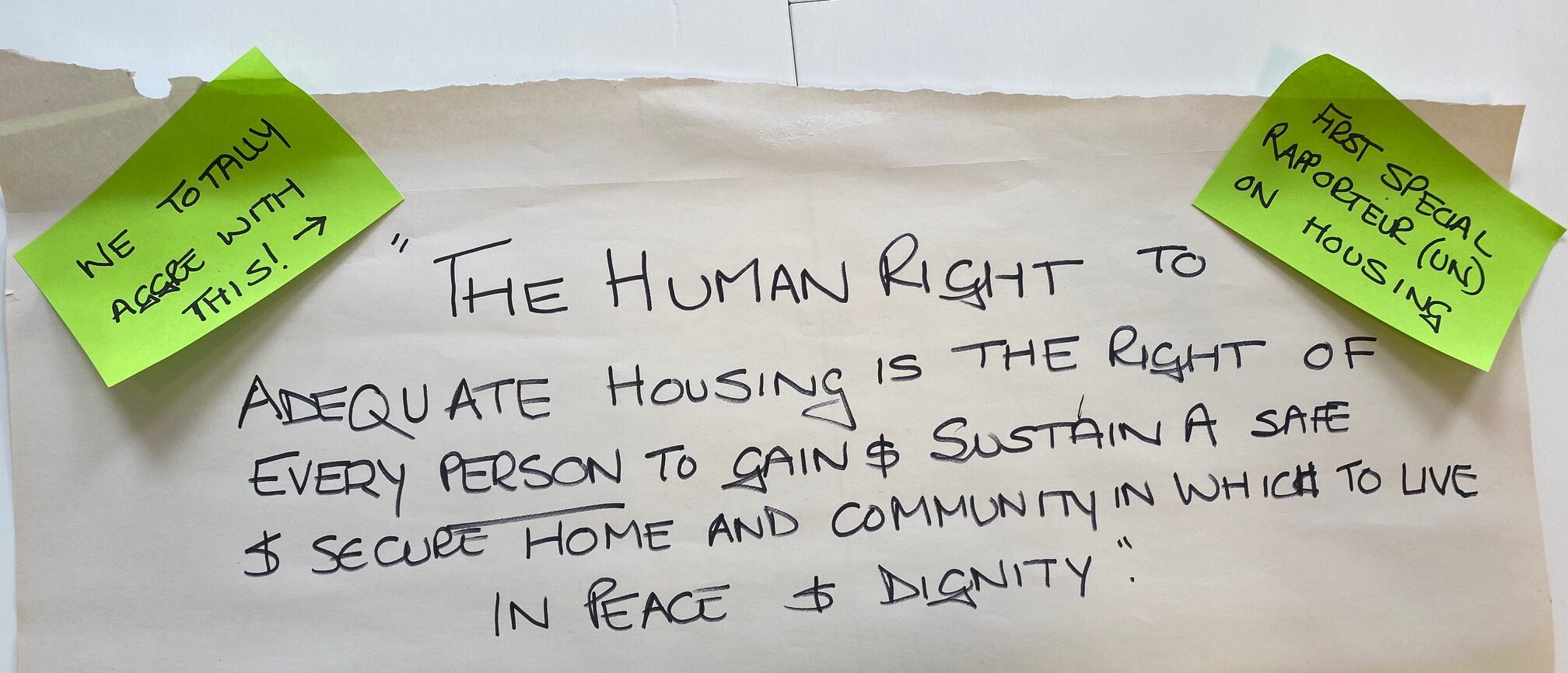 Human right to a home written out on poster paper and post-it notes