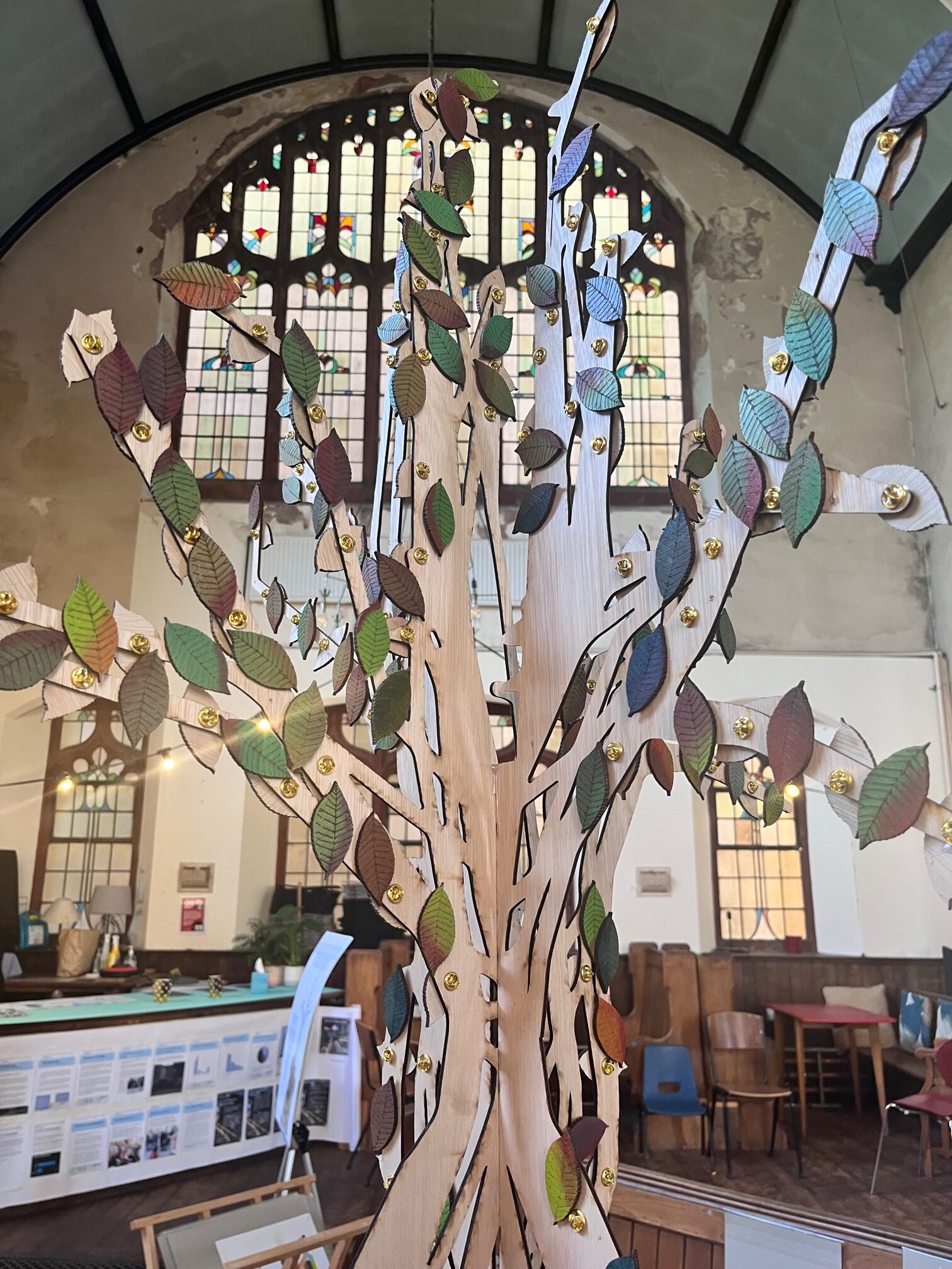 A memory tree from Making It Out, with leaf badges to represent people who have died whilst homeless.