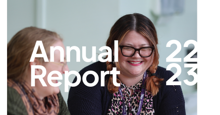 Front cover of Arch's 2022-2023 annual report showing a picture of two Arch colleagues smiling over a cup of tea.